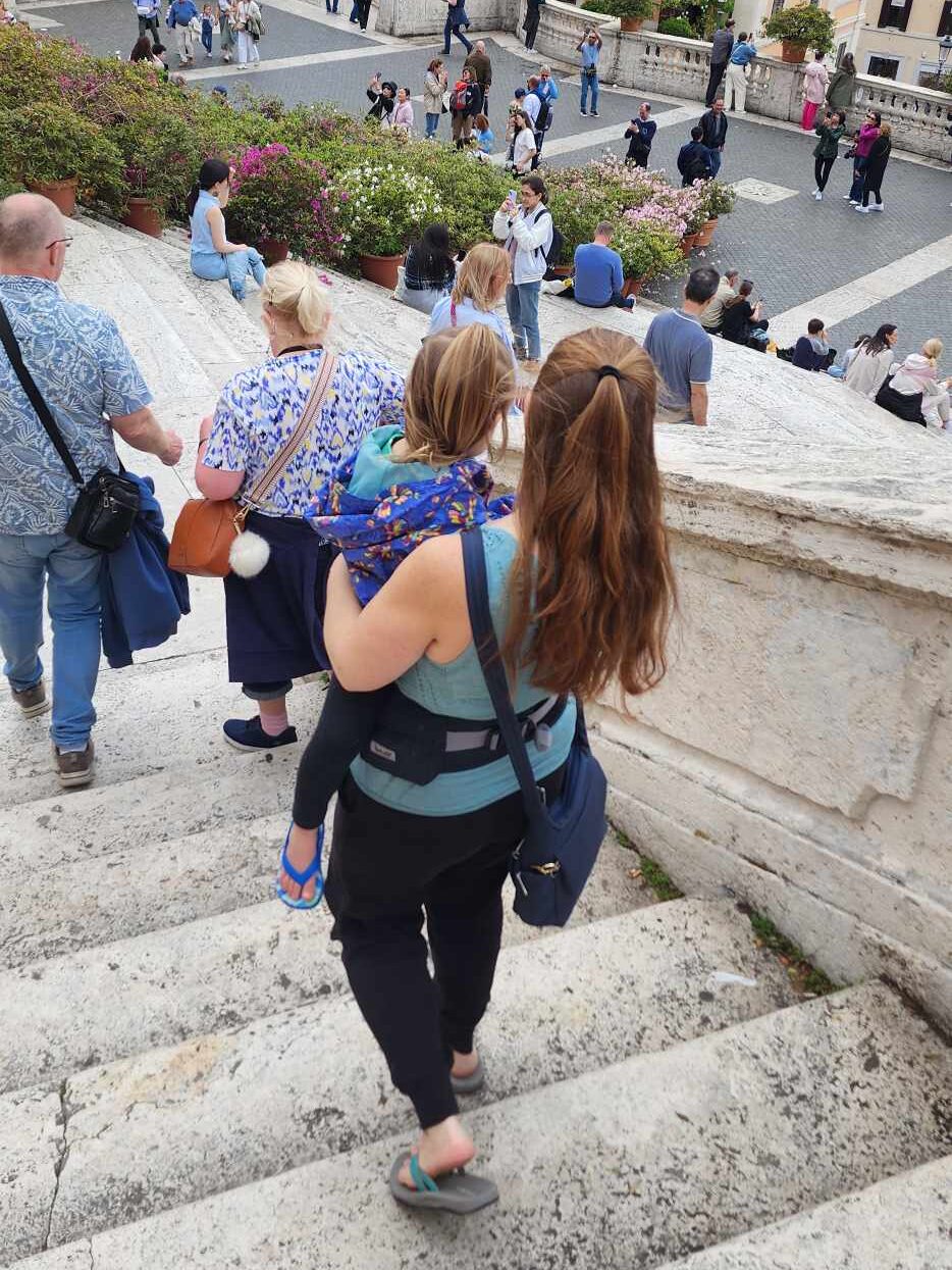 Me carrying my daughter down stairs in Italy