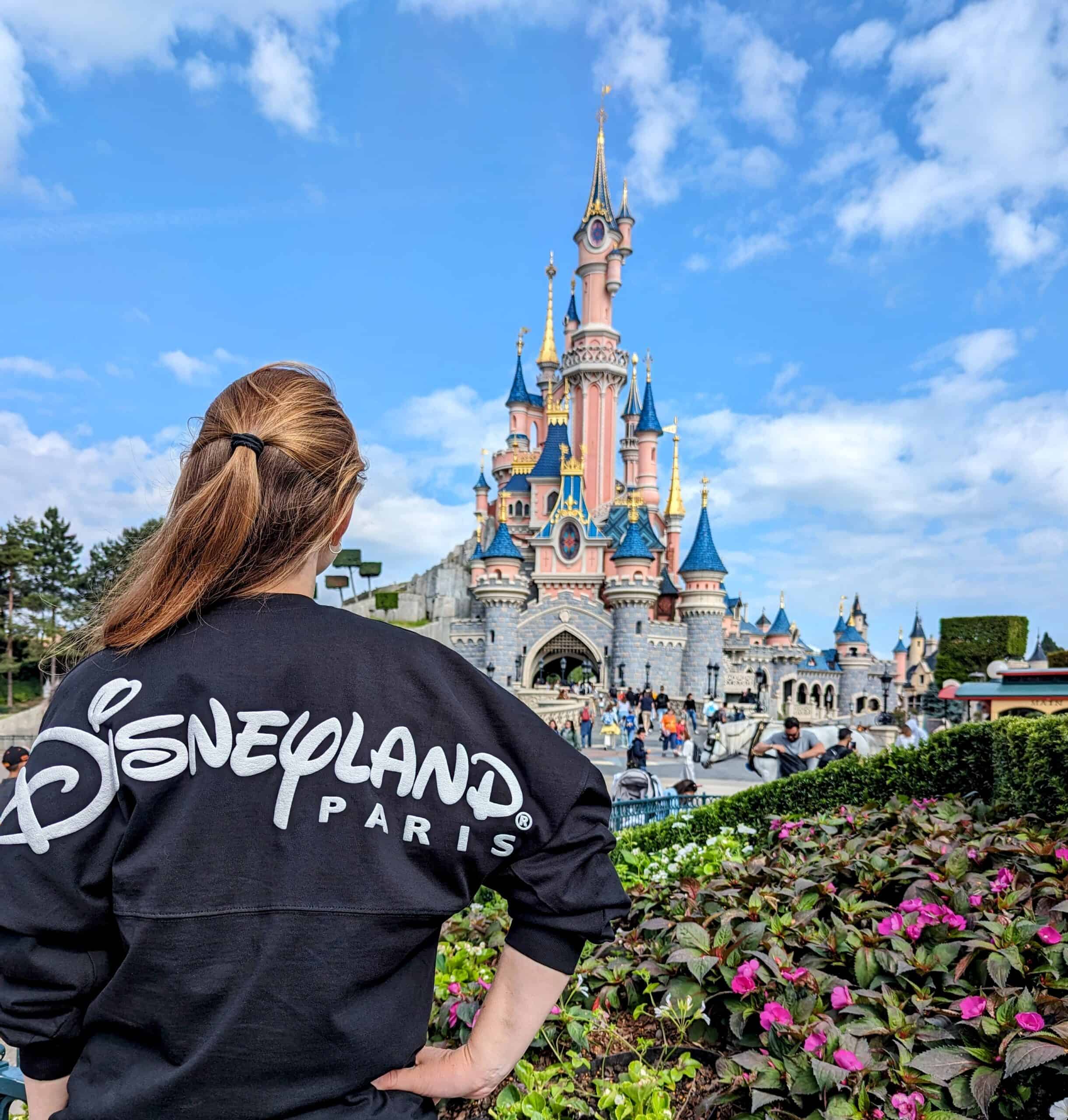 Me standing in front of Sleeping Beauty's Castle sporting my Disneyland Paris Spirit Jersey.