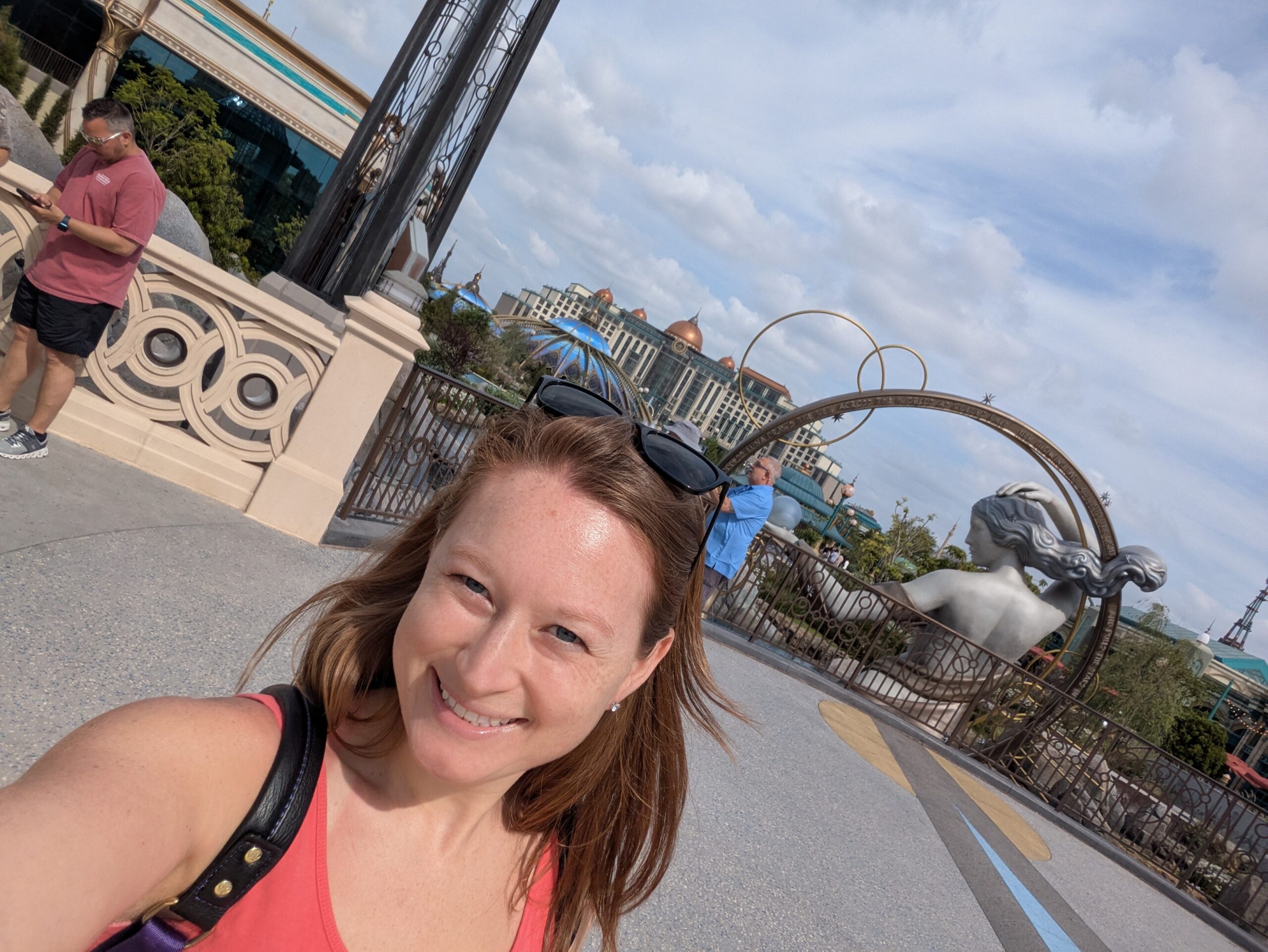 Me standing in front of the entrance statue in Celestial Park