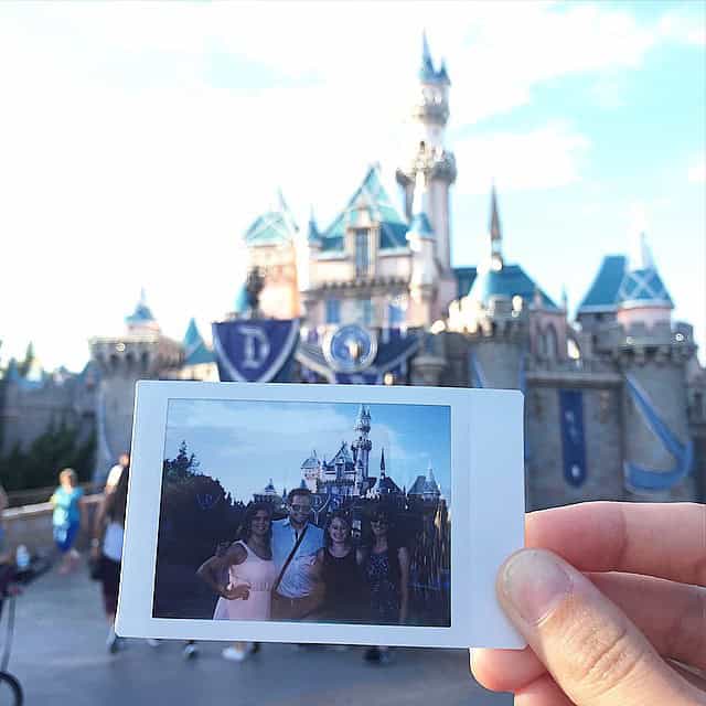 Picture of a polaroid photo featuring in front of the Disneyland CA castle.