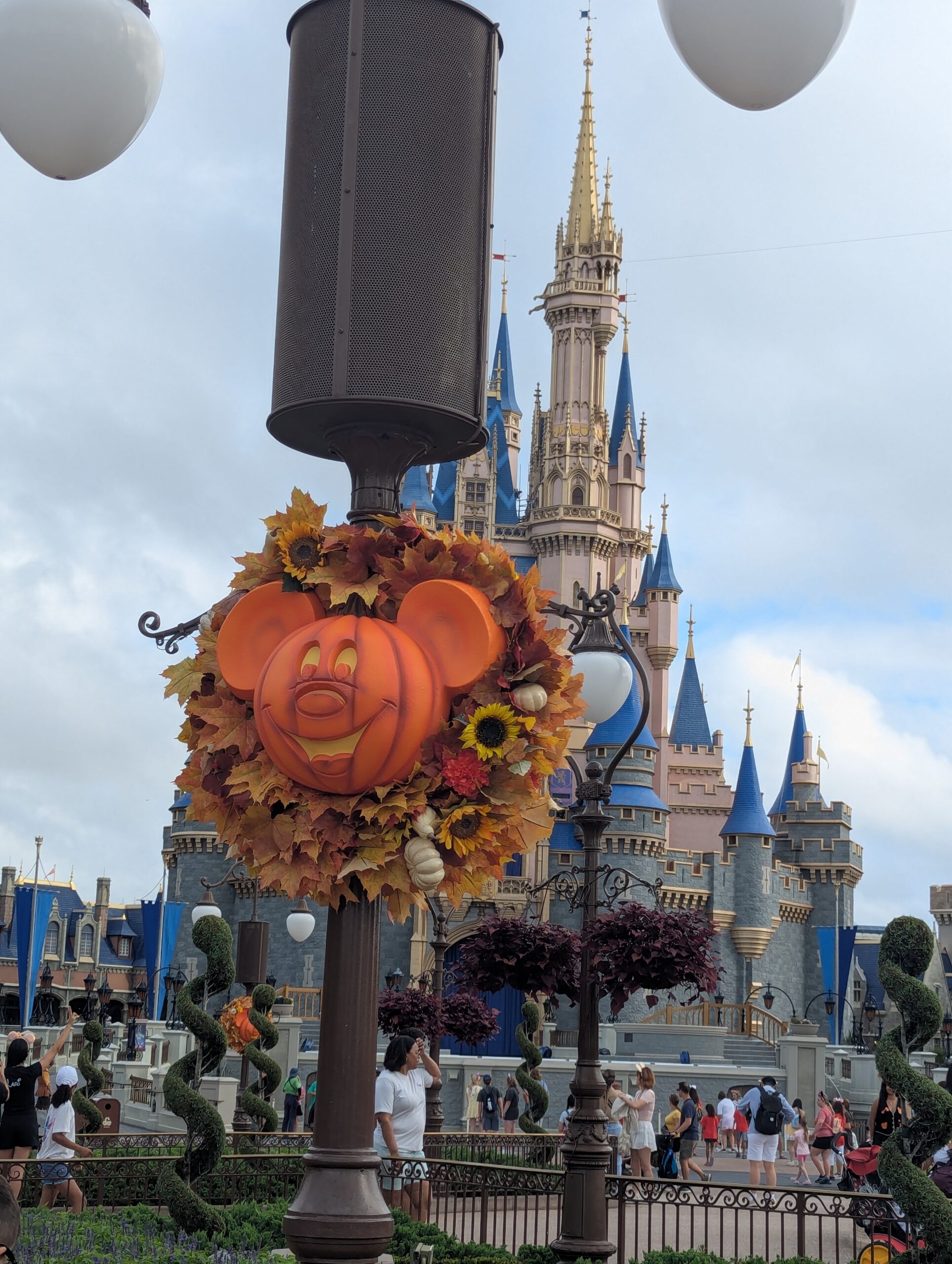 Mickey fall decoration in front of Cinderella's Castle