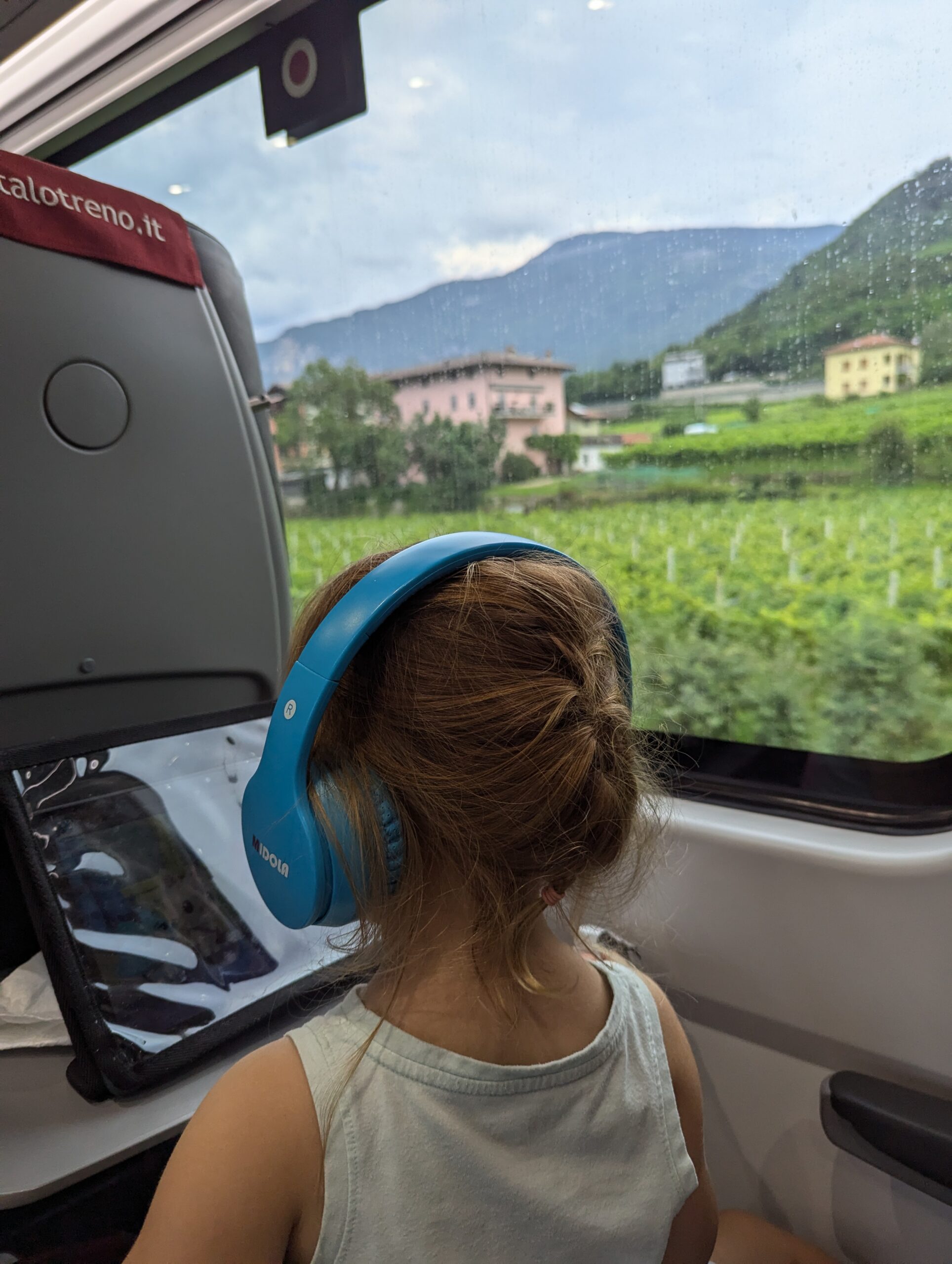 toddler watching a movie on a train