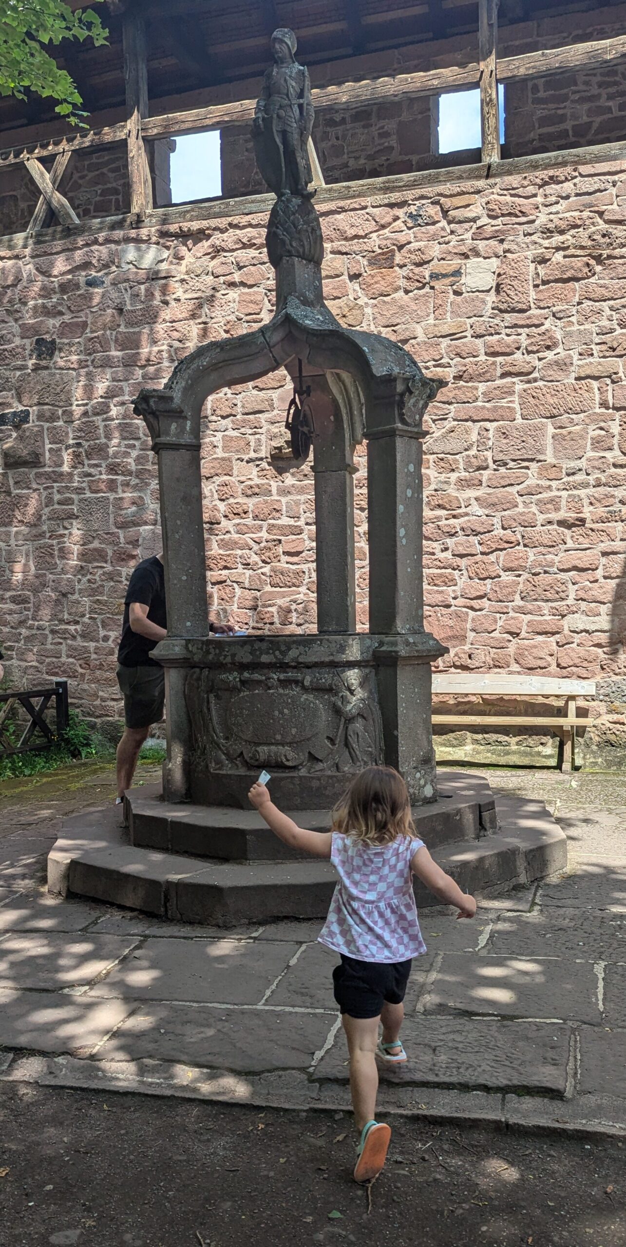 Toddler running to a well